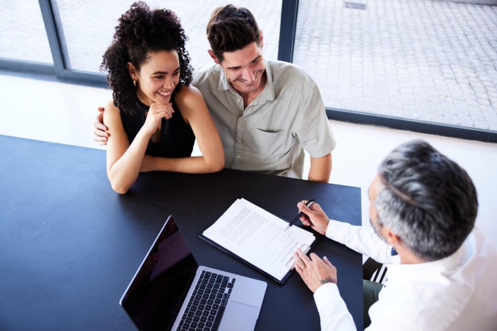 Melbourne homeowner reviewing refinancing options with a mortgage broker at a laptop