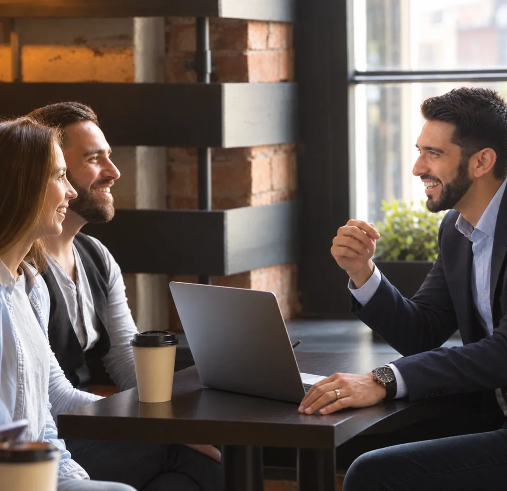 Client discussing home loan options with an independent mortgage broker across a desk instead of going directly to a bank